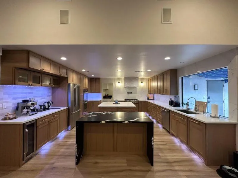 Coffee Bean oak shaker kitchen with large island and under-cabinet lighting