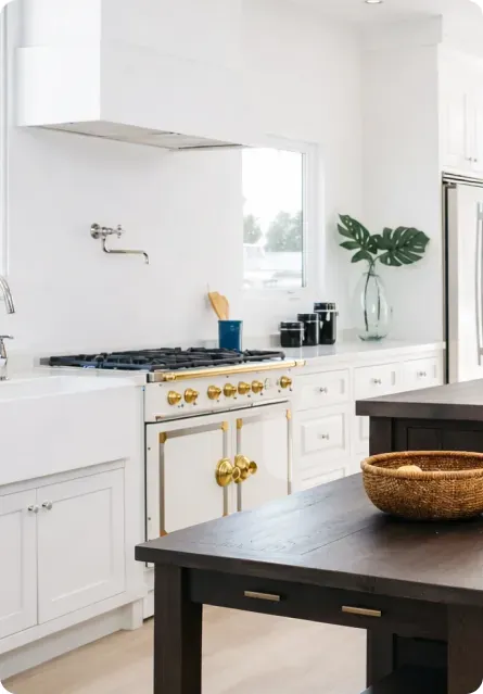 Vintage White inset kitchen with farmhouse sink and dark wood island
